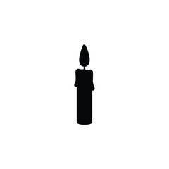A single black candle burning with a flame silhouette
