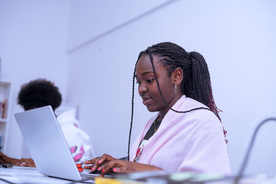 Two african girls interacting during the work time