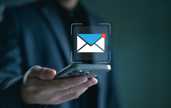 Business communication concept with man receiving email notification on smartphone, representing digital messaging, mobile connectivity, online communication and modern workplace technology.