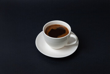 Coffee cup centered on dark background, captured in clean minimalist style suitable for menus, branding, packaging, and elegant food photography