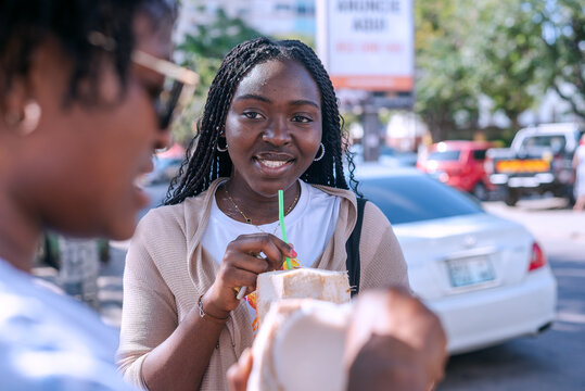 Two beautiful african girls taking a tour in the city