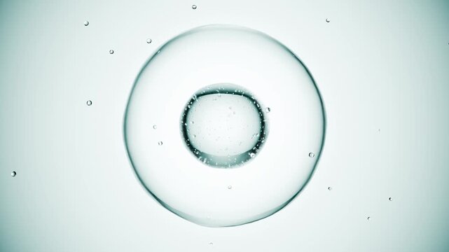 Macro of drops of liquid moving inside bubbles. Skin care serum droplets uniting into one. Cosmetics moisturizer fluid concept. Looping animation