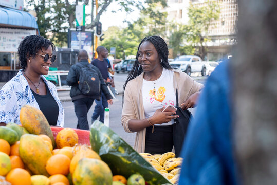Two beautiful african girls taking a tour in the city