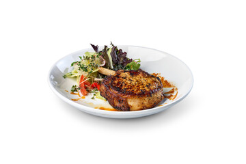 Grilled pork chop with bone and side salad