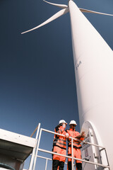 Engineers are inspecting wind turbines to generate electricity.