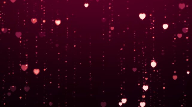 Purple glowing glitter hearts particles falling in soft shimmering motion on dark background. Romantic festive motion design for Valentines Day, wedding or love theme. 4K animation.
