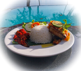 Typical Papuan menu: rice with grilled tuna with colo colo sauce. Signature menu at a resort
