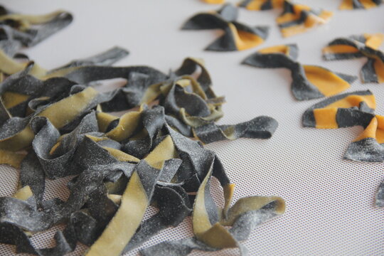 Fresh artisan fettuccine handmade with flour and eggs—long pasta ribbons crafted with care, capturing the rustic soul of traditional homemade Italian cuisine. - Powered by Adobe