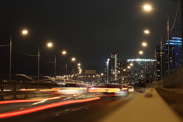 Evening Ryazan. Night traffic on the Northern Ring Road against the backdrop of high-rise buildings