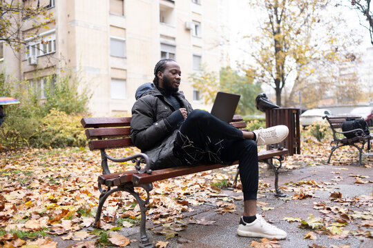 Wireless connectivity enabling digital communication for a man on a bench.
