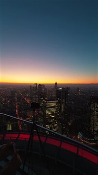 Evening View of Frankfurt's Skyline from the Main Tower, Highlighting the Commerzbank Tower and the Rhine River