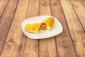 Caracas-style ham and cheese cachitos, baked until perfectly golden brown, ideal to enjoy with café con leche.