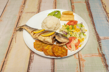  Breaded dogfish, Venezuelan beach style, served with boiled yucca, cabbage salad, and spicy garlic sauce