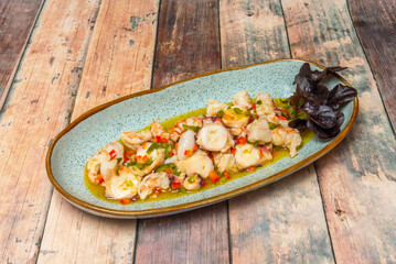 Galician seafood salad with velvet crabs, spider crab, scallops, and cockles, dressed with olive...