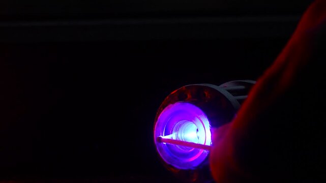 Powerful laser. Dangerous, powerful beam of laser light. Lighting a match.
