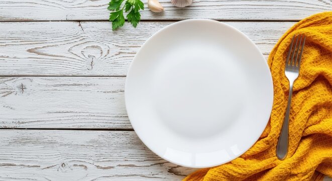 A Culinary Canvas: A simple composition showcasing a pristine white plate, a metallic fork and a piece of parsley leaf set atop a rustic wooden table with a yellow towel.