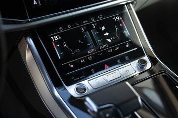 Car climate control. Car interior with climate-control view. Vehicle ventilation and air conditioning system. Turning on the air conditioning of a car on the climate control panel