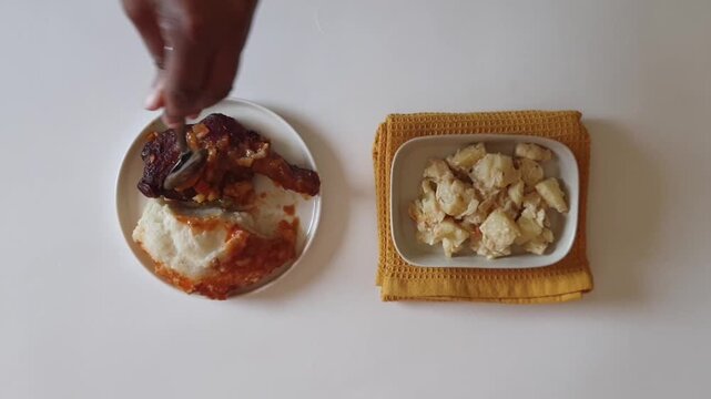 Plating Pap with Chicken on White Plate