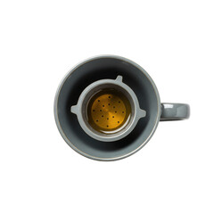Overhead View Of A Grey Ceramic Cup Containing Tea With Stainless Steel Filter Against Transparent Background