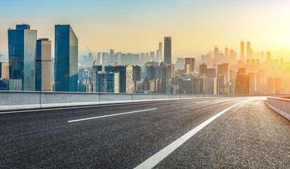 Empty asphalt road and city skyline with modern buildings scenery at sunrise in Guangzhou
