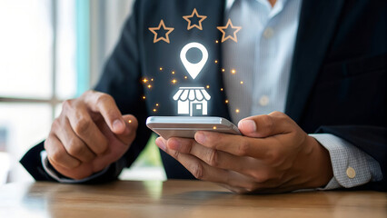 Businessman using smartphone to search for shop location online with star rating and shop icon online business concept for customer