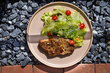 Savory Pan-Seared Steak With Crisp Salad On Beige Plate Over Dark Surface