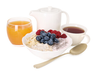 Healthy breakfast. Oatmeal with nuts, berries, yoghurt, tea and juice isolated on white