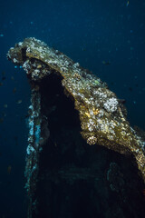 Wreck ship underwater in deep ocean
