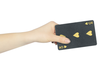 playing card hearts 3 in hand, outstretched hand with black playing card isolated from background