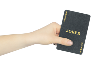 playing card joker in hand, outstretched hand with black playing card isolated from background