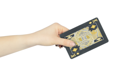 playing card diamonds king in hand, outstretched hand with black playing card isolated from background