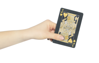playing card hearts jack in hand, outstretched hand with black playing card isolated from background