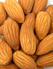 A bunch of almonds are shown in a close up