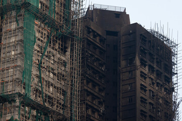 ruins of building after the fatal blaze in Tai Po, Hong Kong, remain of accident fire