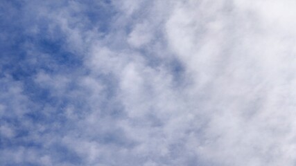 Fototapeta premium Blue Sky with Scattered Altocumulus and Cirrocumulus Clouds