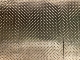 High-resolution metal diamond plate texture with embossed steel pattern, industrial shine, and rugged metallic surface. Perfect for backgrounds, 3D materials, product mockups, and design projects.