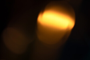 Obraz premium light leak overlay effect with scratch dust and yellow light leaks,retro grain noisy film flare on black background,analog old film burn overlay,abstract background with motion blur ray