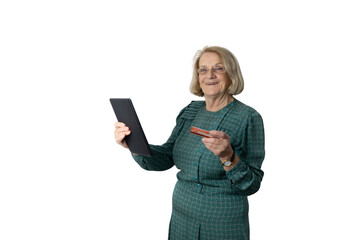 Senior woman shopping online using tablet and credit card