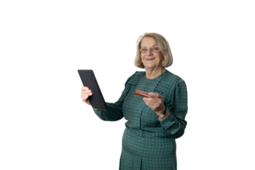 Senior woman shopping online using tablet and credit card