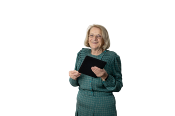 Senior woman smiling and holding tablet with transparent background