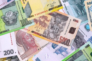 Congolese franc money bills in big amount on table close up. Rich life concept in Democratic...