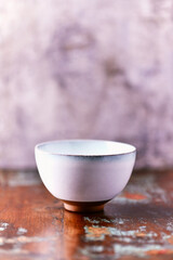 Traditional japanese ceramic on rustic wooden background. Soft focus. Copy space.	