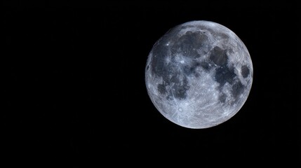 Obraz premium Close-up lunar surface with crisp crater details illuminated by cool blue light. ideal for STEM visuals and astronomy education materials.