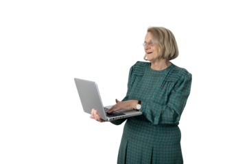 Senior woman smiling using laptop standing on transparent background