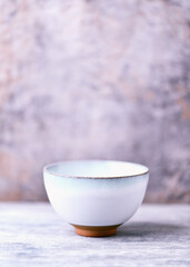 Traditional japanese ceramic on rustic wooden background. Soft focus. Copy space.	