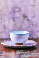 Traditional japanese ceramic on rustic wooden background. Soft focus. Copy space.	