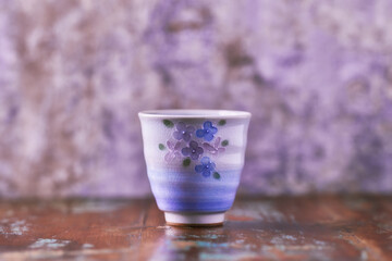 Traditional japanese ceramic on rustic wooden background. Soft focus. Copy space.	