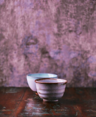 Traditional japanese ceramic on rustic wooden background. Soft focus. Copy space.	