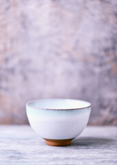 Traditional japanese ceramic on rustic wooden background. Soft focus. Copy space.	
