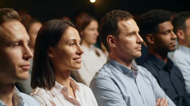 Diverse group of people listening intently at a conference audience, meeting.
